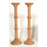 A pair of tall 20th century contemporary plant stands ( used for lights ) being of turned