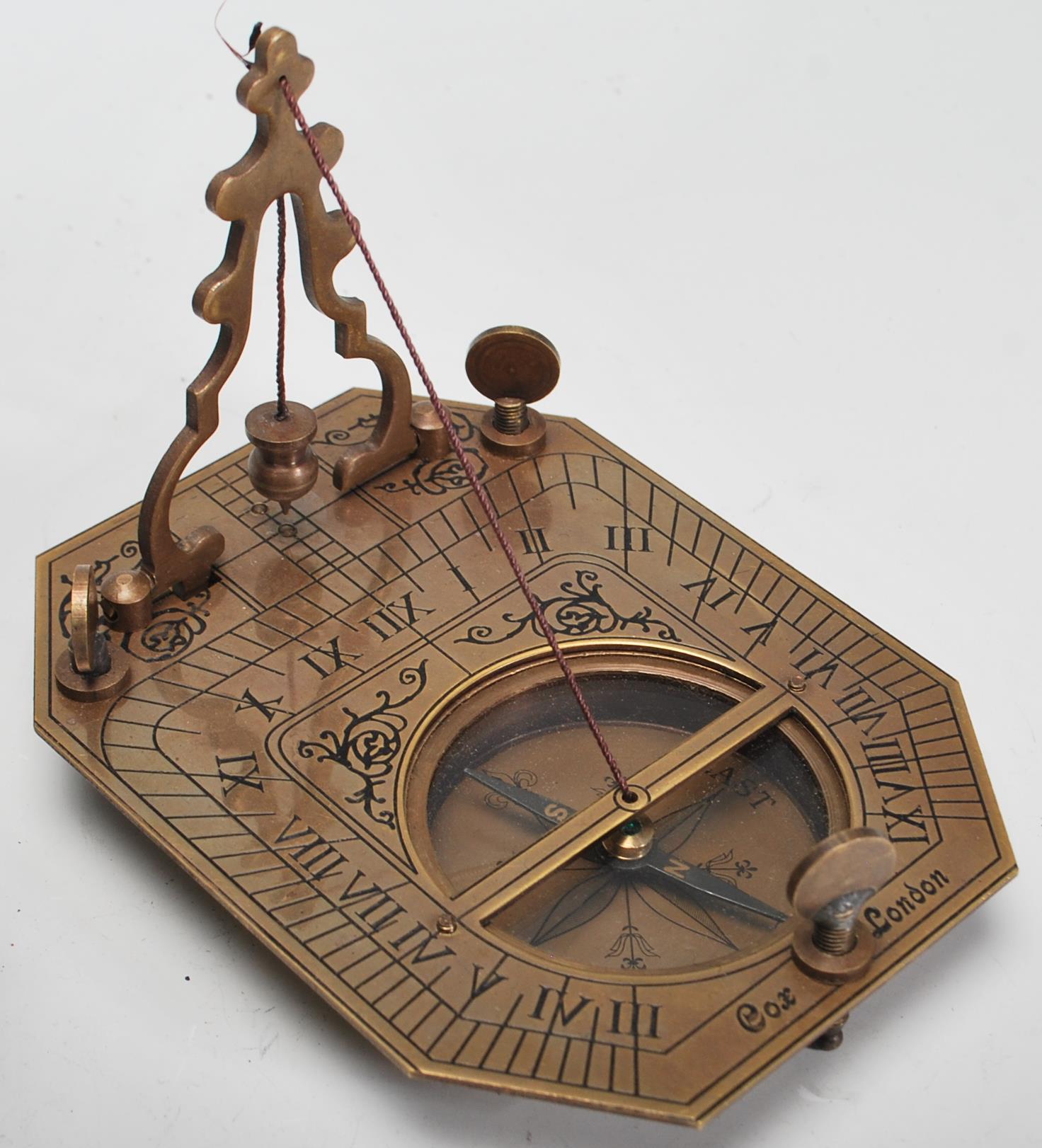 A 20th Century cased brass Sundial Compass, the compass set within the folding metamorphic - Image 2 of 9