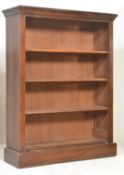 A 19th Century Victorian mahogany open window bookcase, adjustable shelves, flared top raised on a