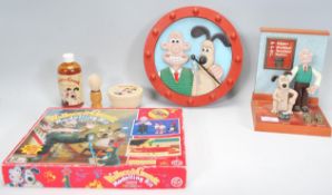 A collection of vintage Wallace and Gromit collectable to include a modelling kit in its original