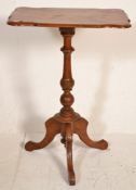 A 19th Century Victorian wine table having a rectangular table top with shaped corners, raised on