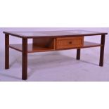 A retro mid 20th Century teak wood coffee table of rectangular form having twin inset glass panels