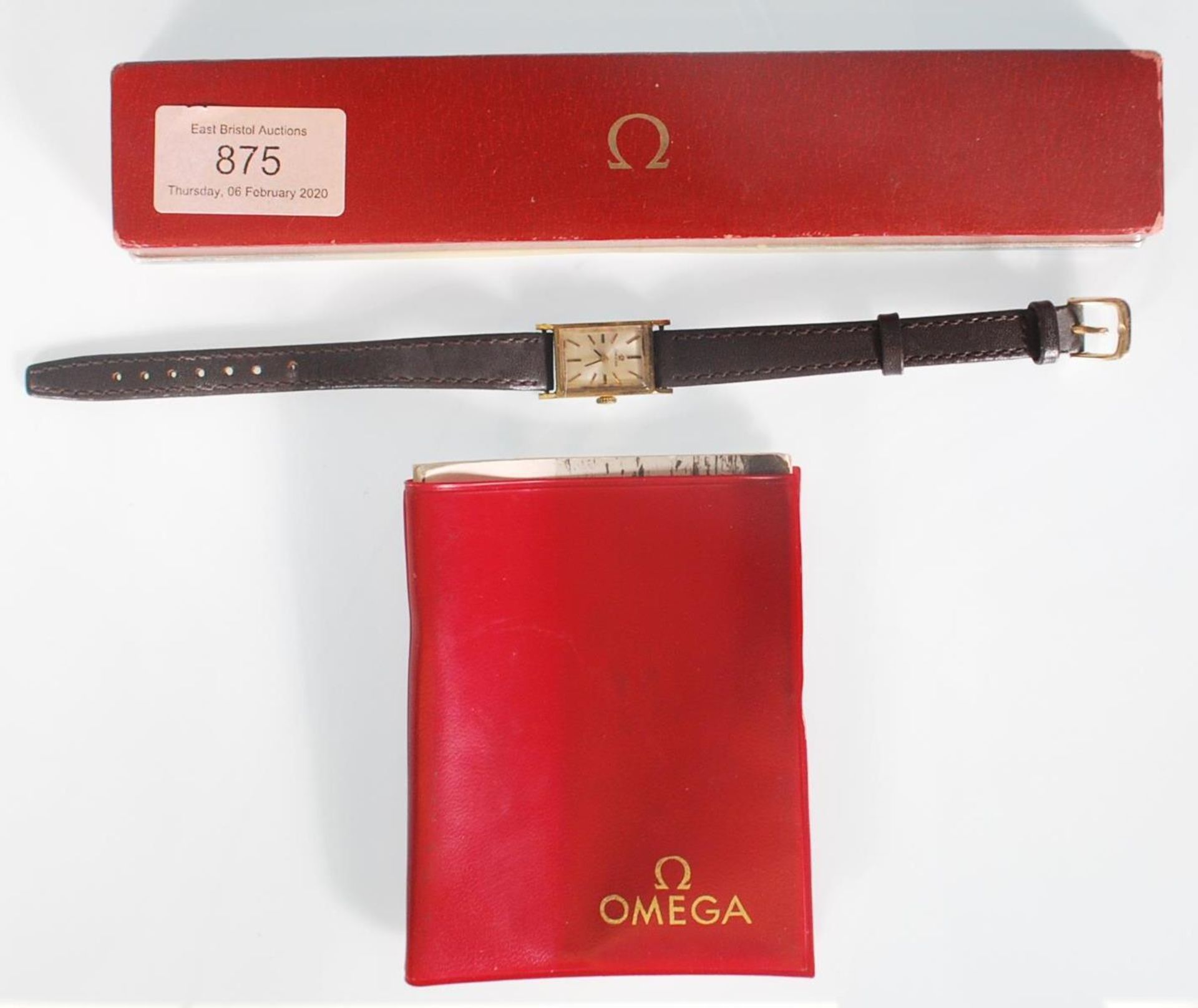 A vintage 1970's ladies Omega wrist watch having a rectangular face with a champagne dial with