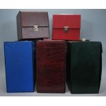 A group of three vintage / retro record LP vinyl carry cases, one in green another in blue and a