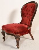 A Victorian 19th century mahogany spoon back ladies armchair. Raised on cabriole legs with hoof feet
