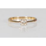 A 9ct yellow gold single solitaire diamond ring of approx 25pts set within a raised mount.