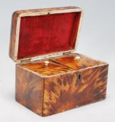 A 19th Century Victorian tortoise shell two division tea caddy with a hinged lid and two sections to