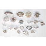 A group of 20 assorted vintage mid 20th Century 50's / 60's silver tone brooches to include a