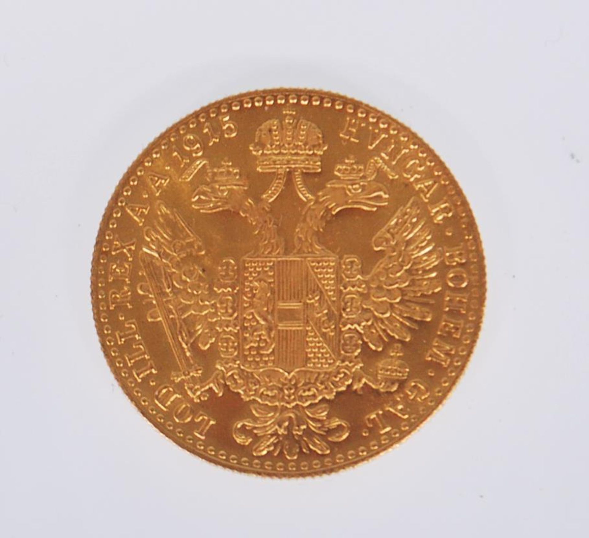 An 18ct gold Austrian 1 Ducat coin (restrike) having a head facing right and coat of arms to the - Bild 2 aus 2