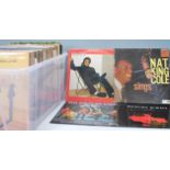 A selection of mixed Vinyl long play LP vinyl record albums to included artists Elton John, The