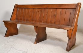 A Victorian 19th century Gothic Arts & Crafts solid oak pew bench of ecclesiastical form being