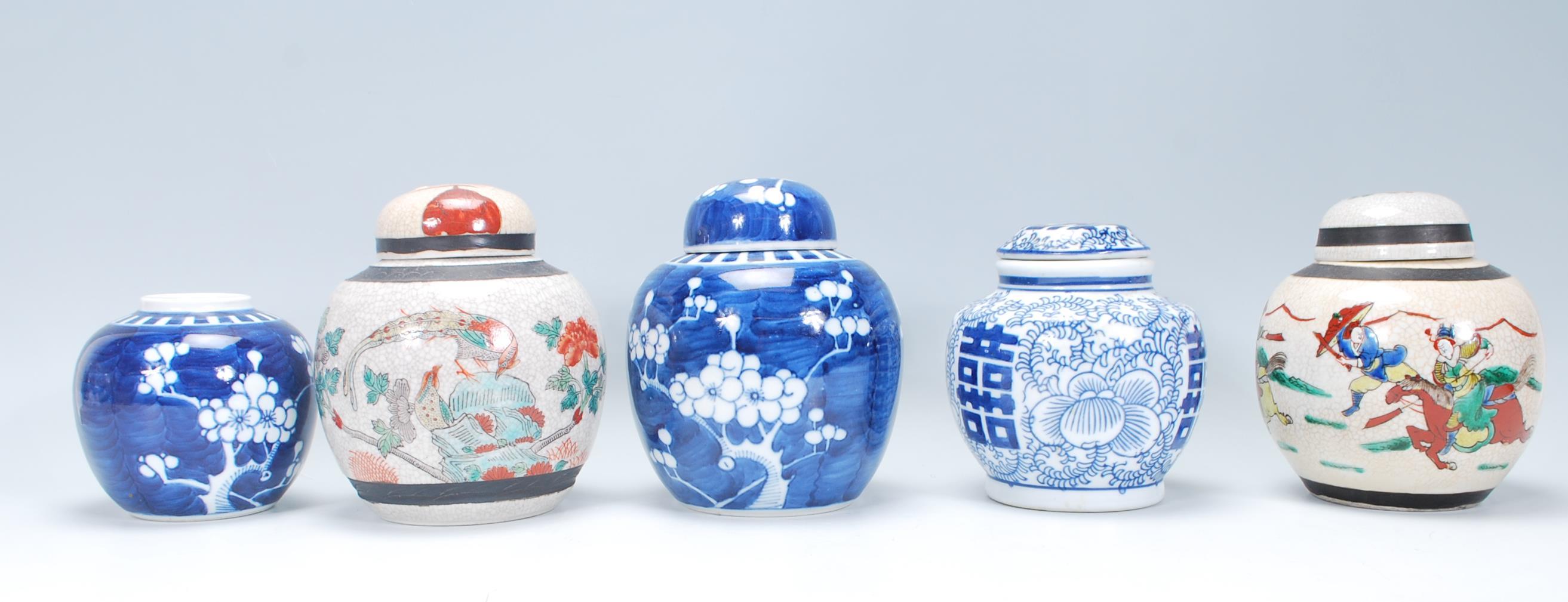 A collection of five Chinese ceramic ginger jars to include two painted in the prunus pattern (one