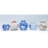 A collection of five Chinese ceramic ginger jars to include two painted in the prunus pattern (one