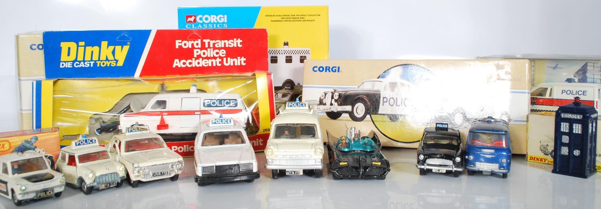 A collection of vintage diecast police related vehicles to include a boxed Ford Transit Police