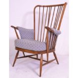 A vintage retro 20th Century Ercol golden dawn spindle back armchair having turned splayed legs