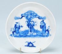 A 19th Century Chinese porcelain dish of round form having painted in blue and white depicting the