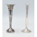 Two silver tulip / spill vases. One having a flared top with both of tapering form raised on round