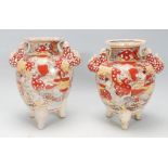 A matching pair of early 20th Century Japanese Kuitan ware having hand painted oriental scene and