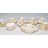 A vintage 20th Century 1940's Shelley six person tea service consisting of cups, saucers, side