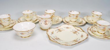 A vintage 20th Century 1940's Shelley six person tea service consisting of cups, saucers, side