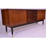 A mid 20th Century G-Plan Librenza model sideboard / credenza, having a central bank of three