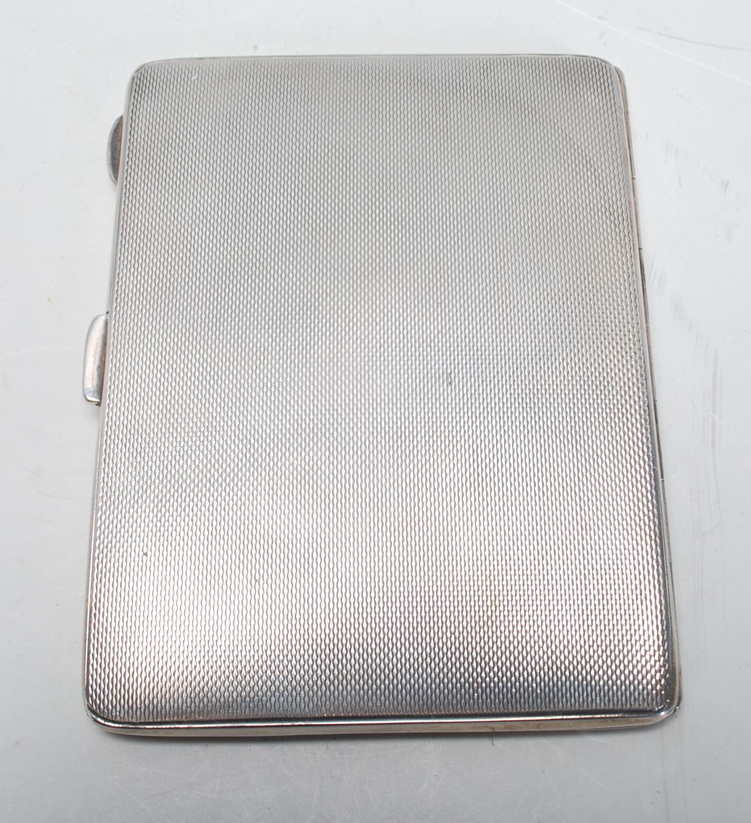 A vintage 20th Century English silver hallmarked cigarette case of rectangular form having engine - Image 4 of 7