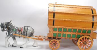 A large vintage 20th Century Gypsy Caravan and shire horse. The gypsy wagon of domed form with