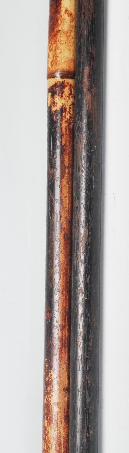 A pair of 20th century wooden walking sticks havin - Image 8 of 9