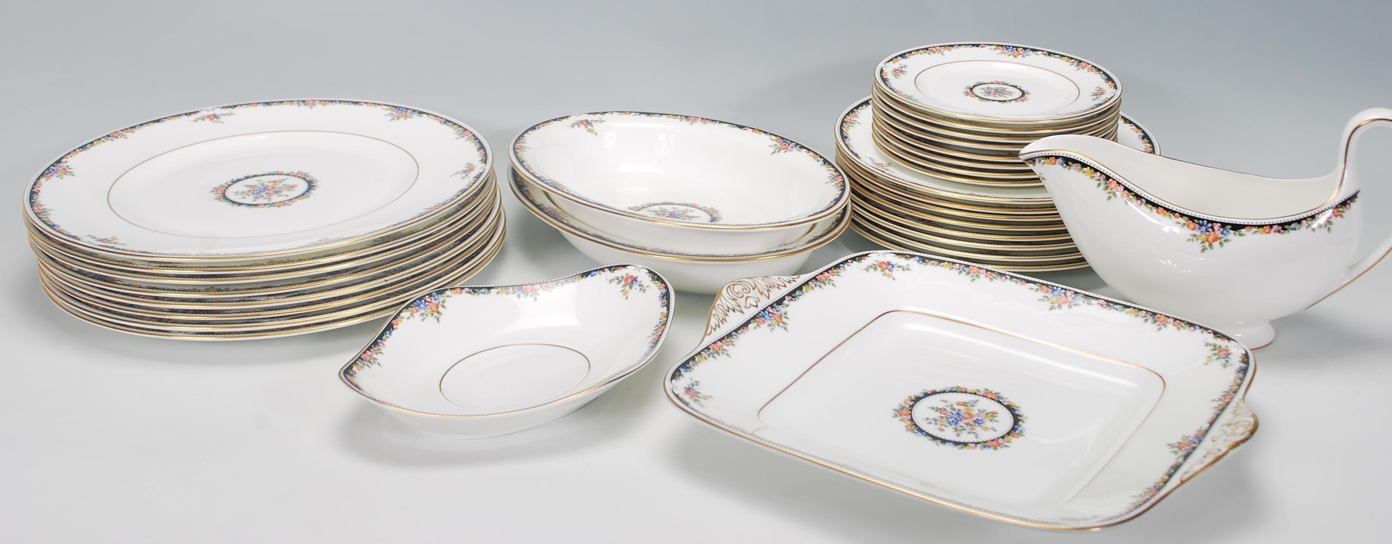A Wedgwood Bone China dinner service in the Osborne R 4699 pattern