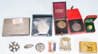 A selection of 19th and 20th Century curios and medals to include an Art Nouveau brass miniature