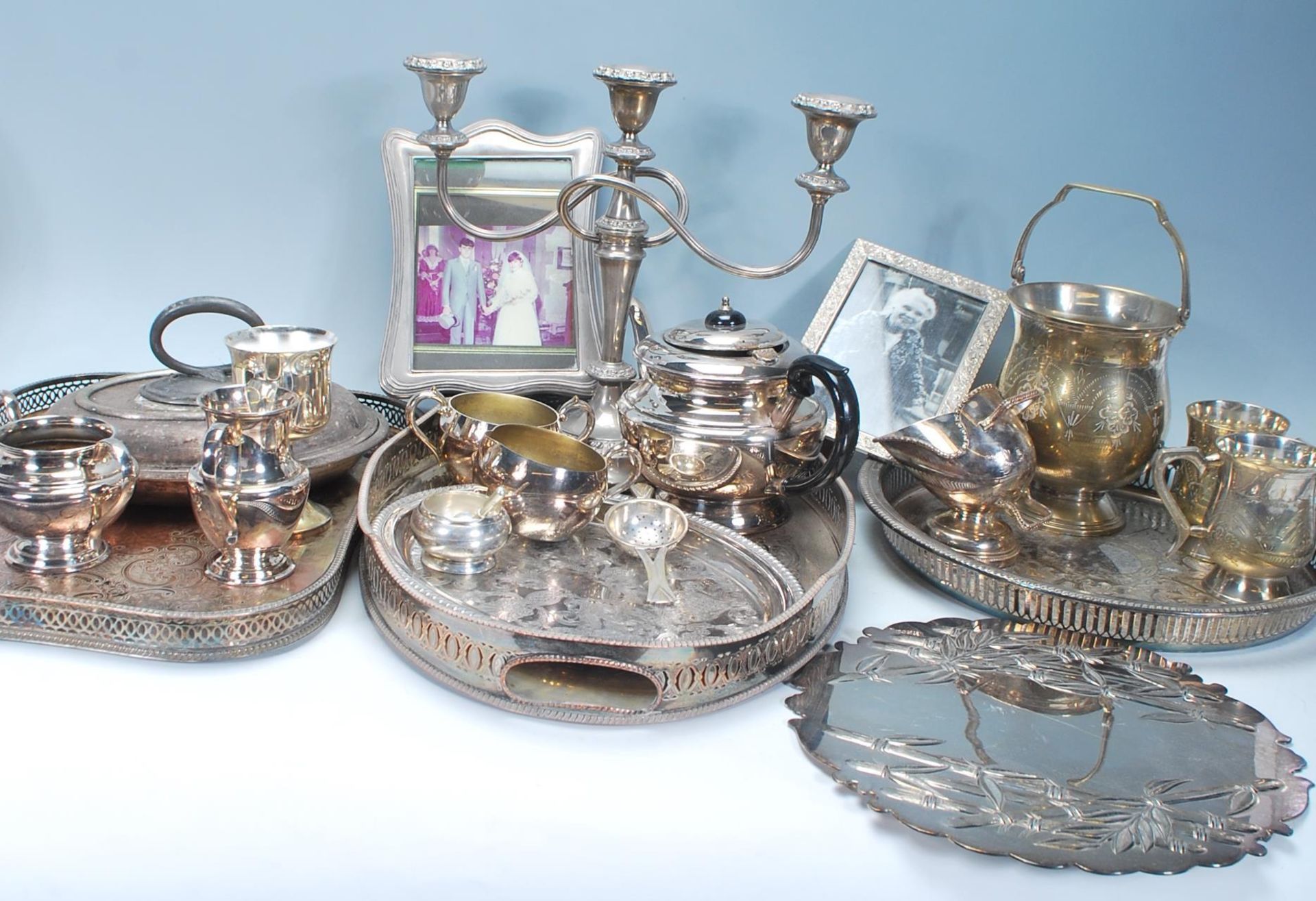 A selection of vintage silver plated items dating from the early 20th Century to include a three