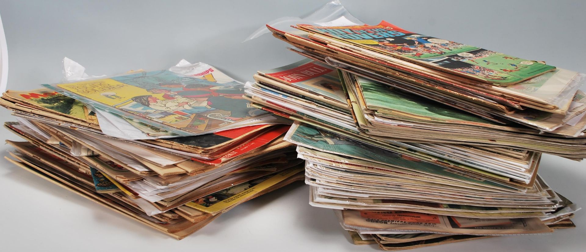 A large collection mixed vintage 20th Century magazines and comics to include a selection of John