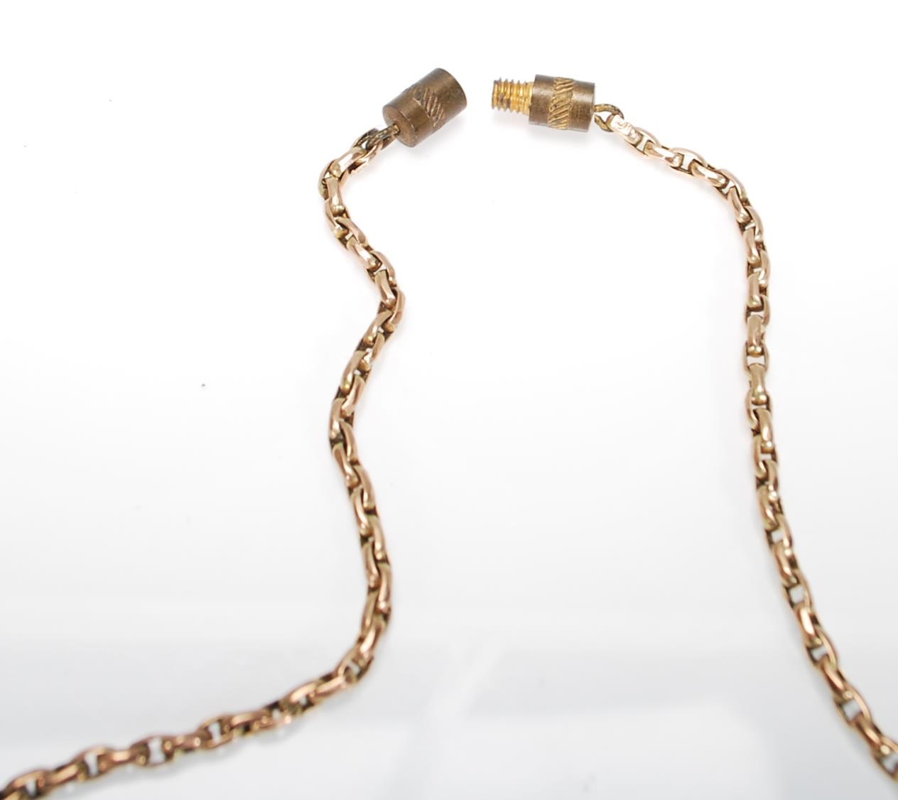 An antique stamped 9ct gold necklace chain with later screw clasp having an oval form gold plated - Image 7 of 7