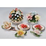 A group of vintage 20th Century Capodimonte ceramic flower ornaments of varying colours, two