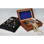 A collection of vintage and latter costume jewellery to include multiple pairs of earrings, rings,