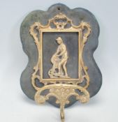 A 19th century Victorian brass hat and coat stand being of scroll work design  with figural scene of