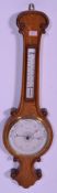 An early 20th century Botly & Lewis of Reading oak wall barometer. The heavy thick banjo barometer