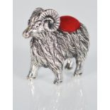 A small sterling silver pin cushion in the form of a ram. Measures: 3.4 x 4.3 x 1.2. Weight: 14.6g.