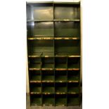 A vintage mid 20th Century Industrial sectional metal factory pigeon holes/cubby cabinet unit having