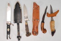 A collection of 20th century hunting knives to include SAS example within scabbard, Palestinian