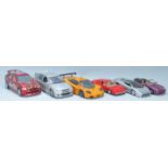 A collection of 1/18 & 1/24 diecast model toy cars comprising of a UT Models 1/18 Ford Escort, UT