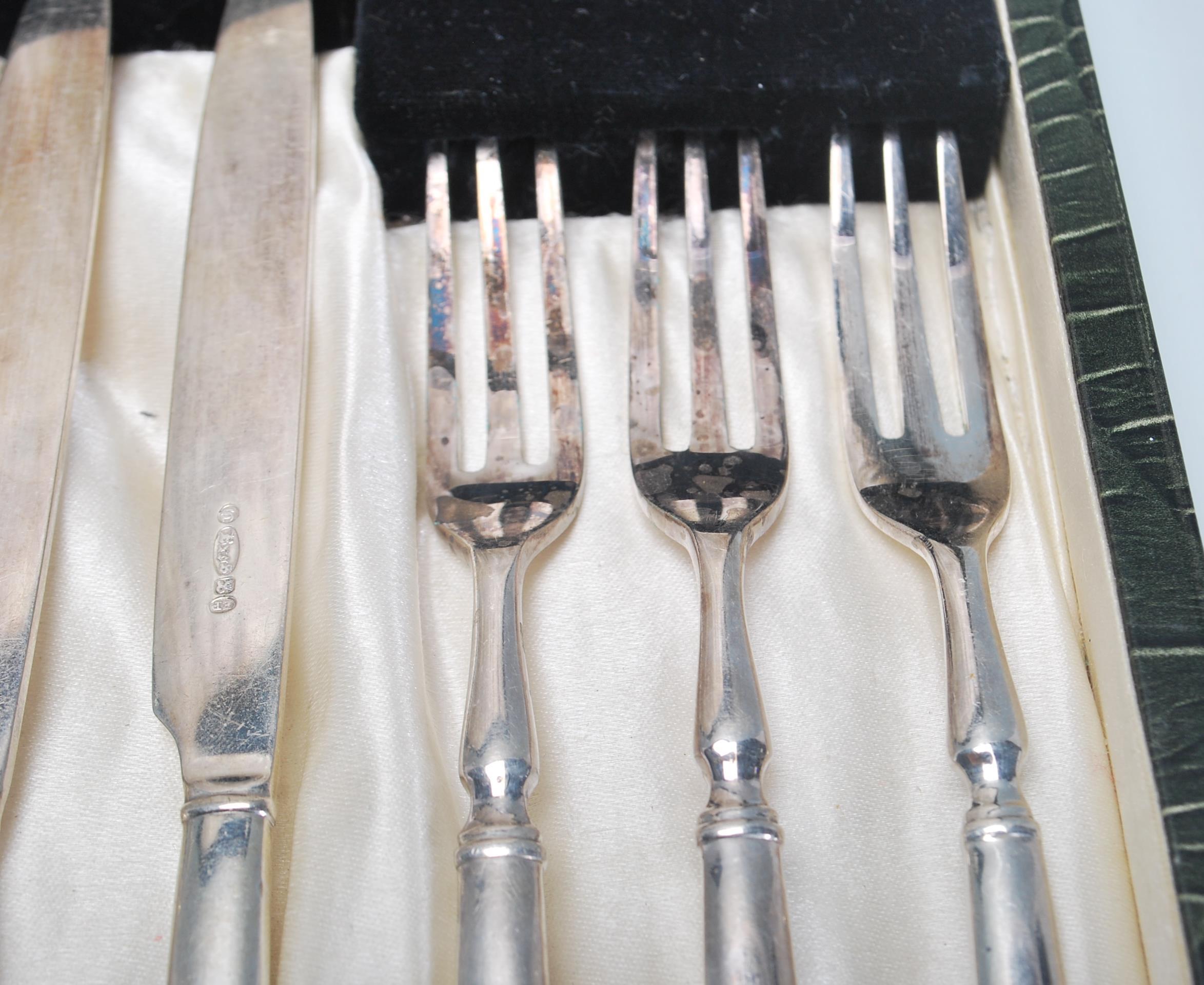 A vintage silver plated cake knife and fork set consisting of six knives and forks set within its - Image 6 of 9