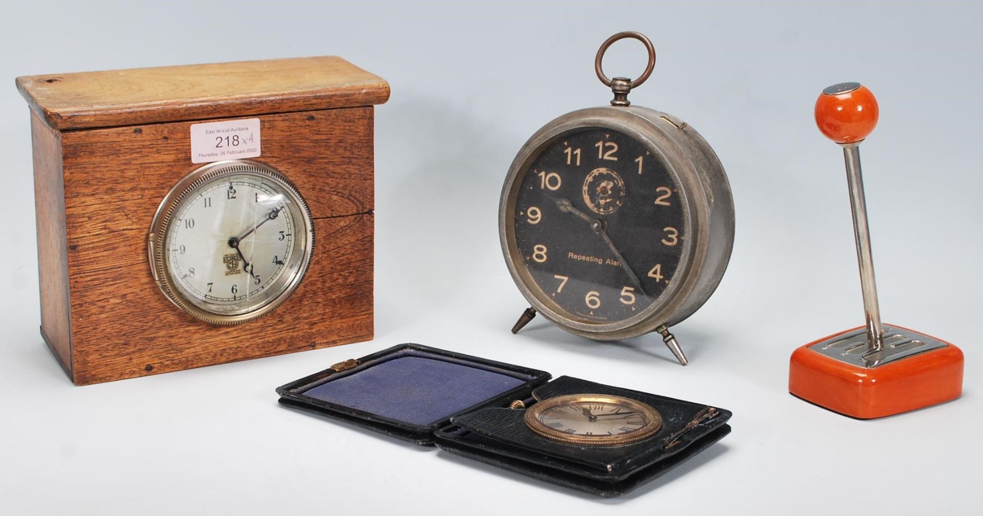 A selection of vintage 20th Century items to include a folding travel clock having a round face with