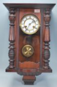 A vintage 20th century mahogany cased Vienna regulator style pendulum wall clock having a glazed