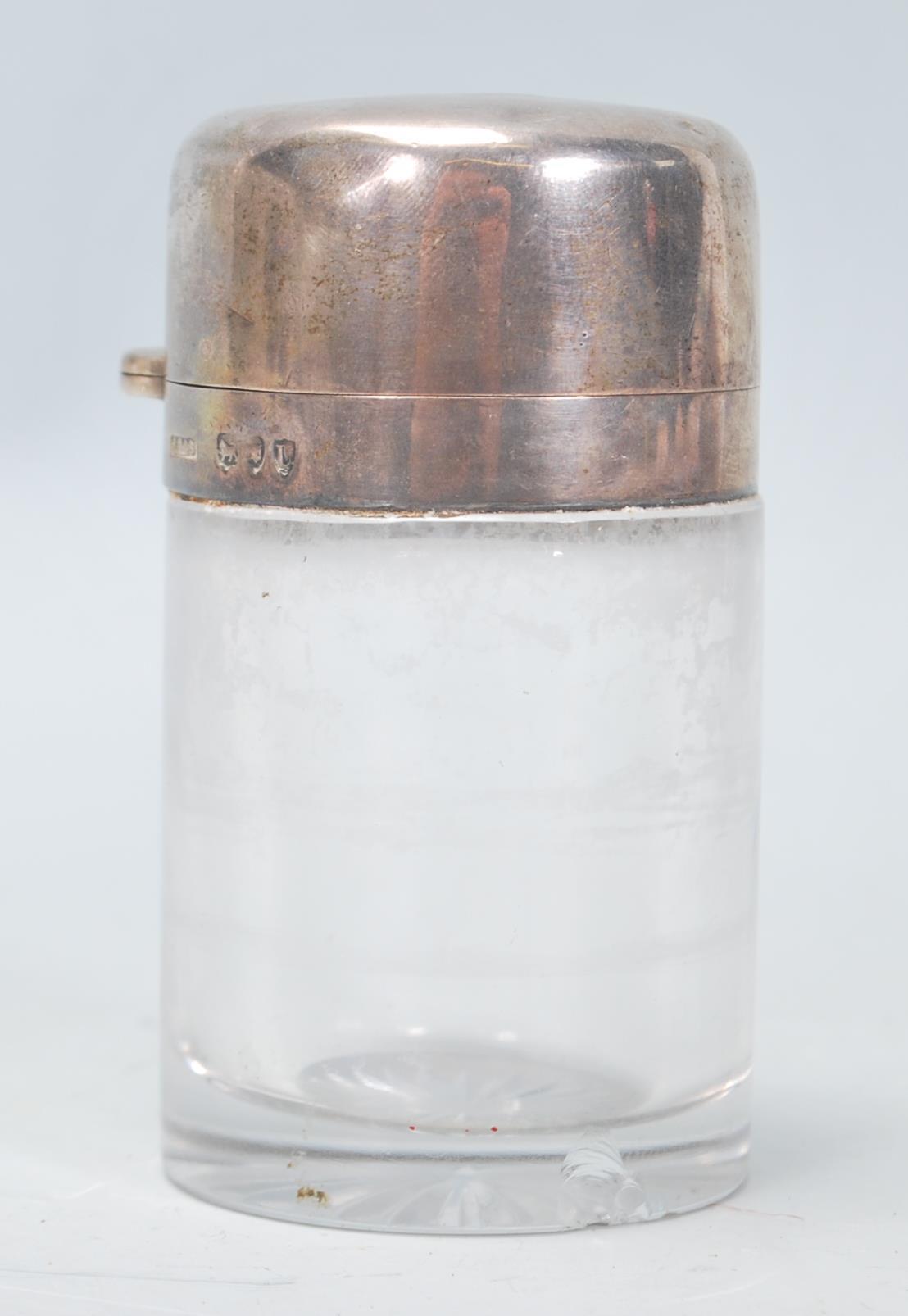 A late 19th Century Victorian glass bodied cylindrical pot having a silver hallmarked hinged lid and