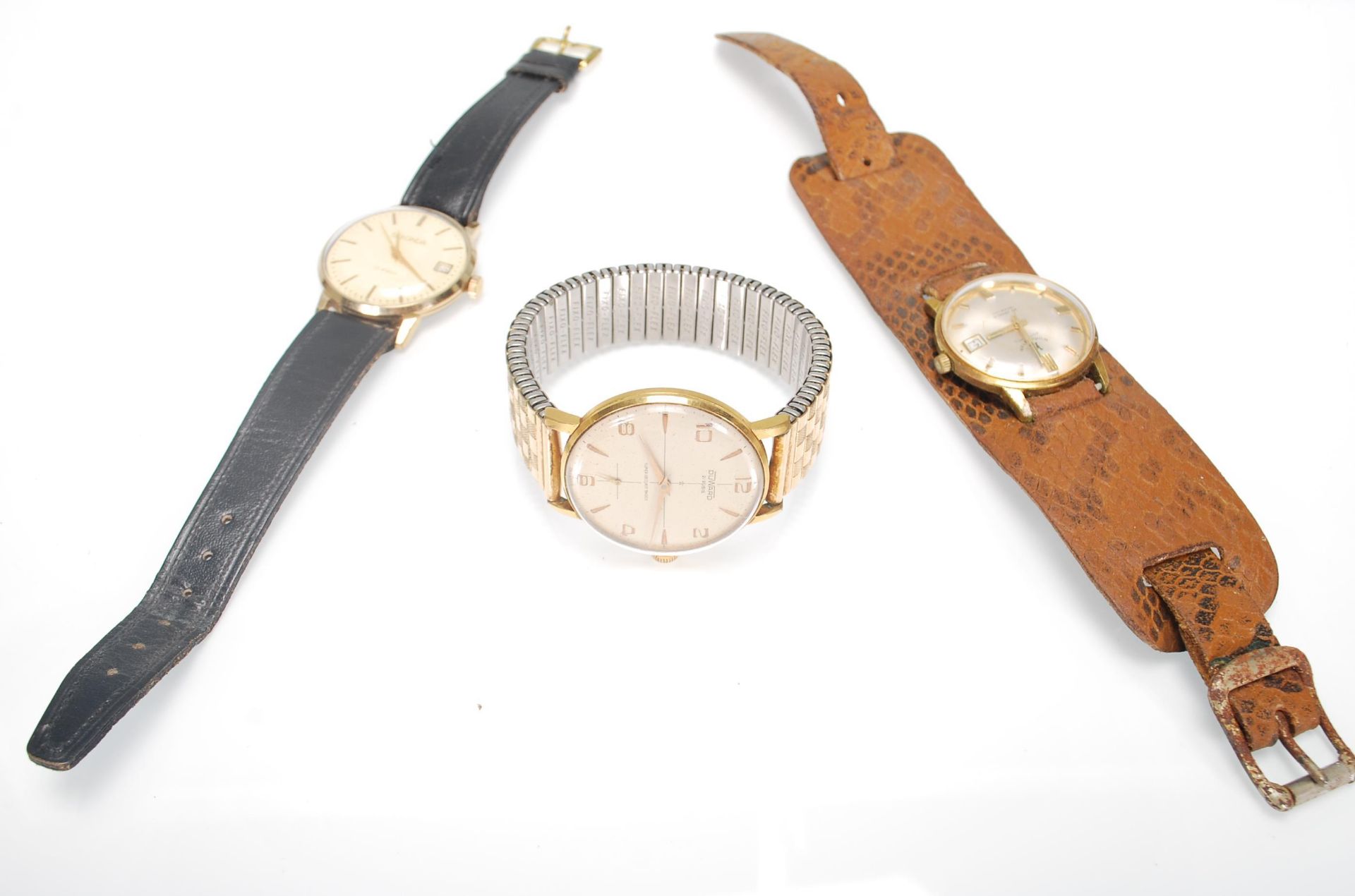 A group of four vintage gentleman's wrist watches