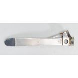 A good silver hallmarked cigar cutter of lung rectangular form having engine turned decoration and