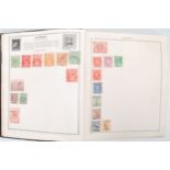 A 20th Century world stamp album to include a wide selection of early 20th Century stamps and some