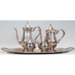 A silver plated coffee and tea service by Oneida Silversmiths. The set of simple form having