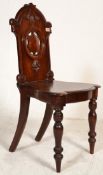 A 19th Century Victorian Victorian mahogany butlers hall chair having turned knopped legs with a